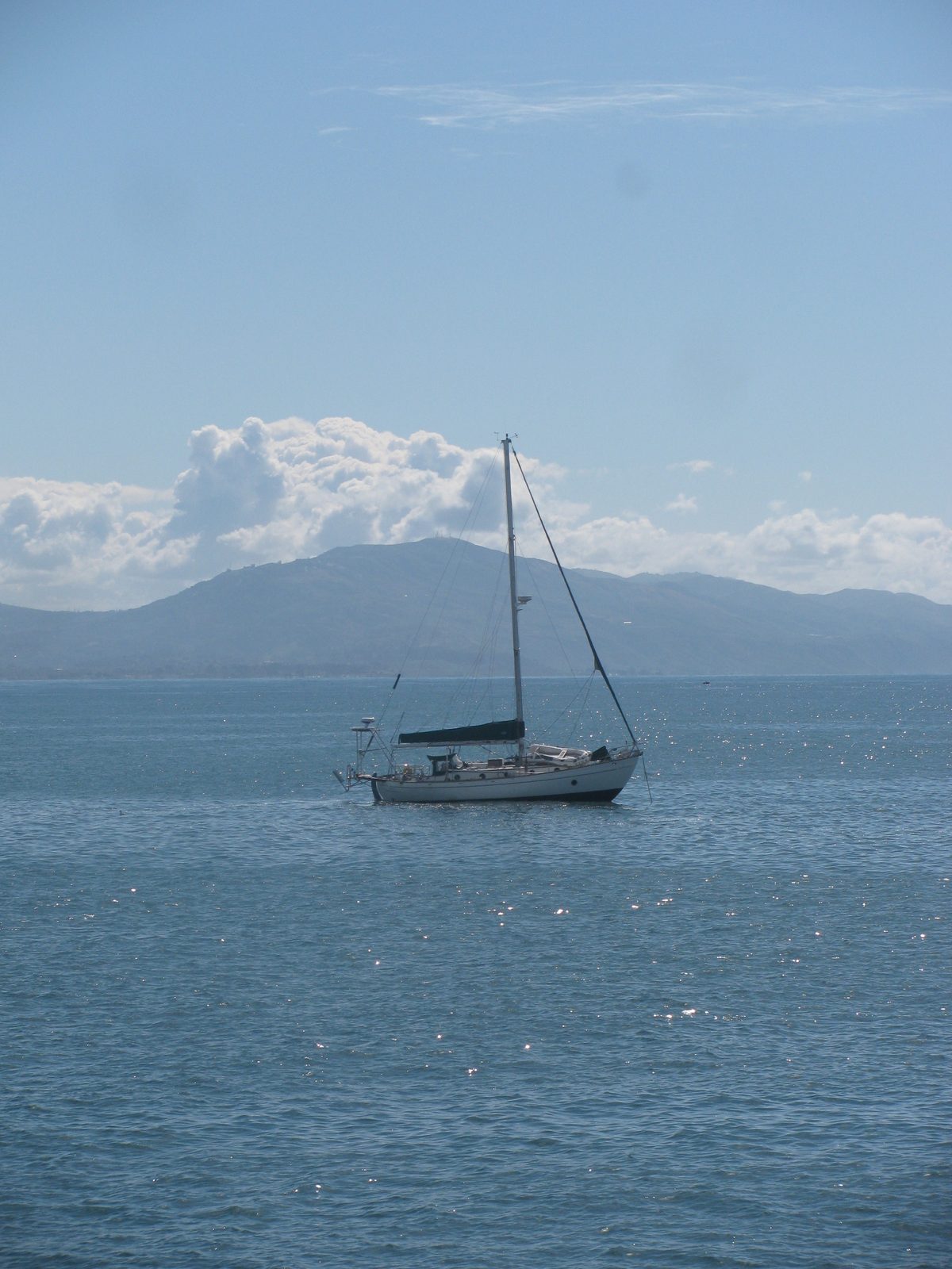 Sailboat drifting on calm water